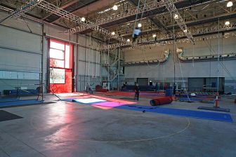 This photo depicts a vast training space for circus performers.