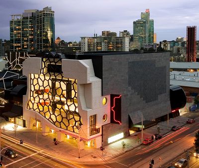 An aerial view of Melbourne Recital Centre at night, lights are on in the building