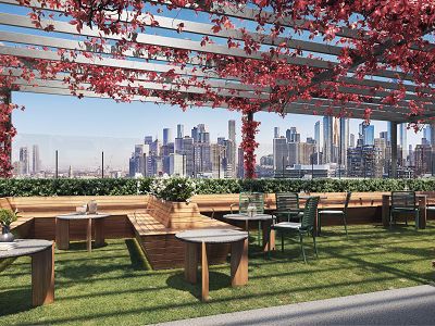 A render of the outdoor living space on the rooftop of The Alba, trellis' with vines and timber fixed seating with outdoor tables and chairs can be seen along with the Melbourne skyline in the background