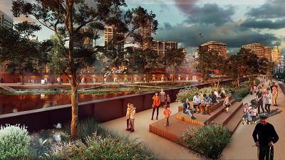 Render of people hanging out on a wide bridge with seating and plants in the middle. Behind is the city skyline.