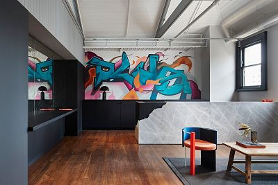 A series of photos of the Plus Architecture studio interiors. It's a bright, open plan space designed for contemporary working with touches of heritage and Melbourne culture, including exposed brick walls and graffiti art.